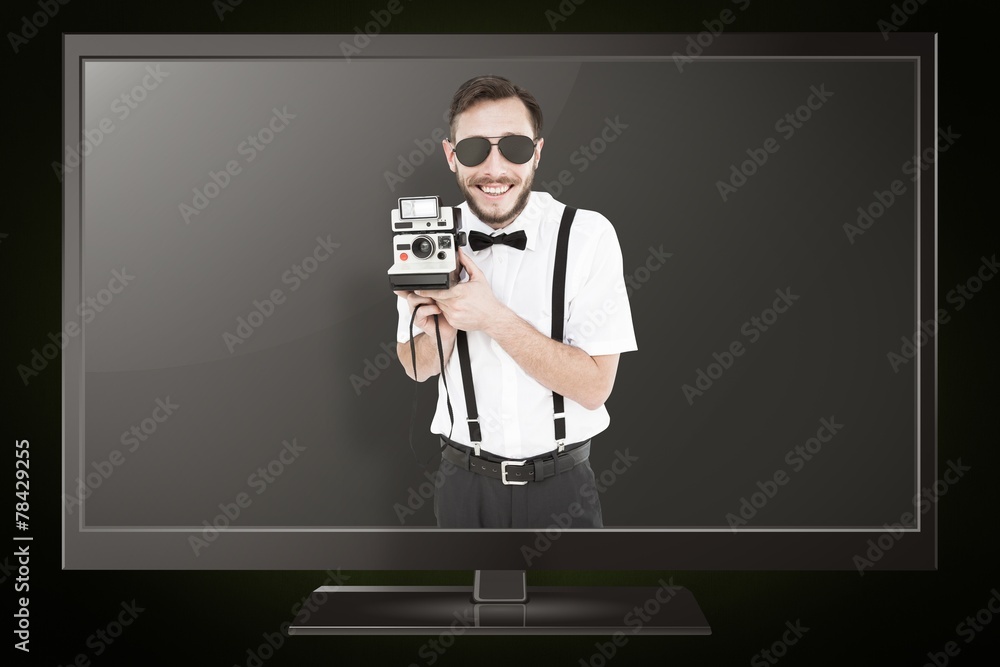Poster composite image of geeky hipster holding a retro camera