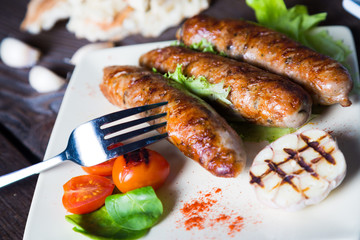 Grilled sausages with vegetables