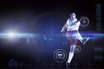 Composite image of football player in white kicking