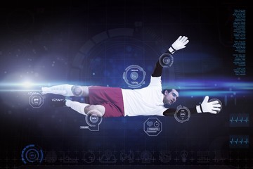 Composite image of goalkeeper in white making a save