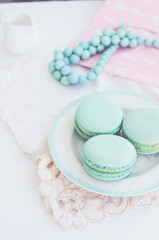 Pastel mint macaroon on light background