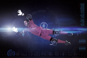 Composite image of fit goal keeper jumping up