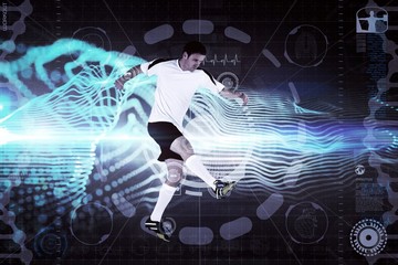 Composite image of football player in white kicking
