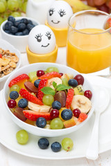fruit salad, cream and painted eggs for breakfast