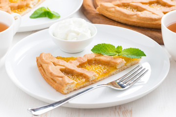 piece of fresh apple pie with whipped cream on a plate