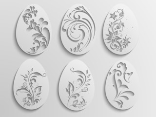 Creative floral design decorated Easter Eggs on grey background.