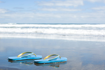 Fototapeta na wymiar summer shoes on beach