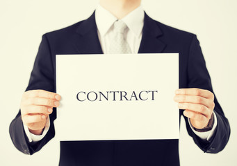 man hands holding contract paper