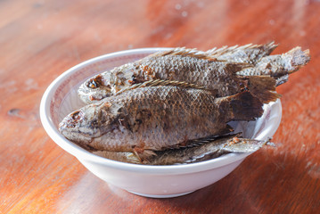 Fried fish on a white plate