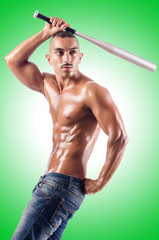 Fototapeta na wymiar Muscular man with baseball bat on white