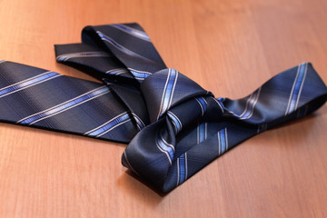 Detail of a windsor knot on  blue knotted