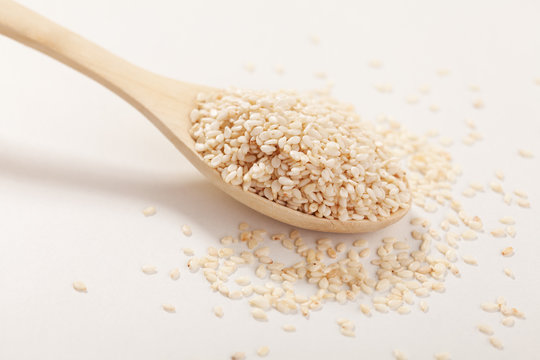 Sesame seeds in a wooden spoon