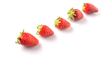 Strawberries over white background