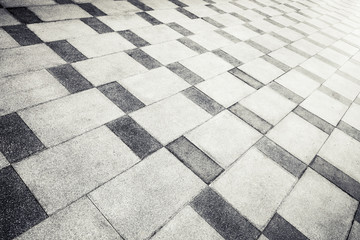 Gray concrete tiling with abstract pattern, urban pavement