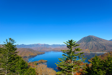 Fototapeta na wymiar Lake Chuzenji and Mt.Nikko-Shirane in Autumn, in Oku-nikko, Toch