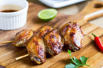 Grilled chicken wings with chili sauce