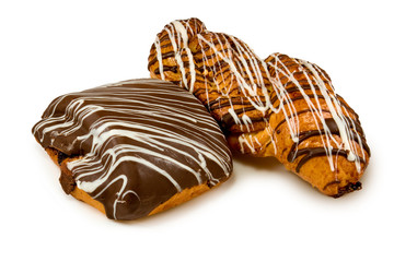 different cookies on a plate on white background
