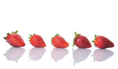 Strawberries over white background