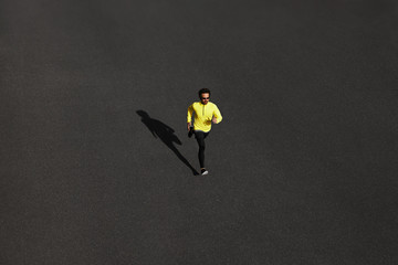 Top view runner man running sprinting for success on run
