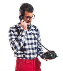 Posh boy talking to vintage phone