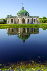 Grotto pavilion with reflection in the water park Kuskovo, Mosco