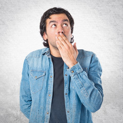 Man doing surprise gesture over white background