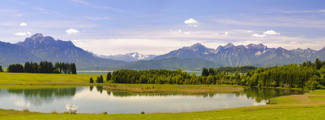 panora landscape in Bavaria at lake Forggensee and alps