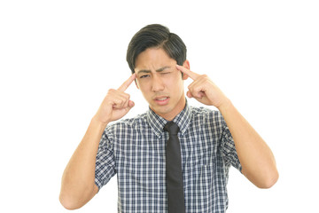 頭痛を訴えるビジネスマン