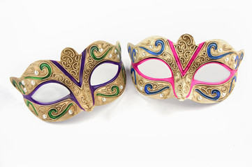 Female carnival masks on white background