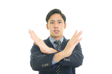 禁止の意思表示をするビジネスマン