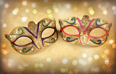 Female carnival mask on vintage background