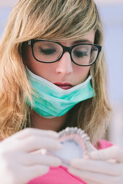 Dentist Working on a Denture