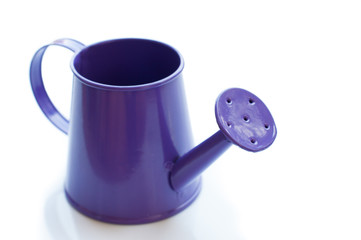 purple watering can. It is isolated on a white background