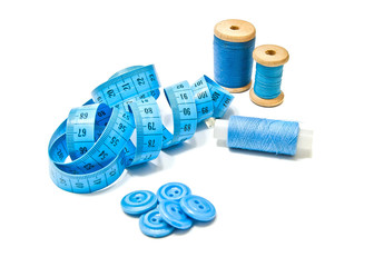 spools of thread, buttons and meter