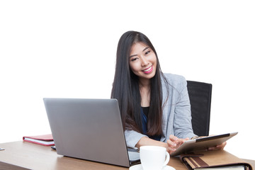 Businesswoman reading latest news on tablet