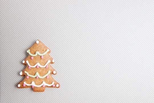 Gingerbread cookies over light grey textured background