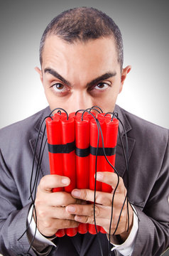 Businessman with dynamite isolated on white