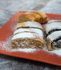Roll cake with poppy seeds, walnut and cheese