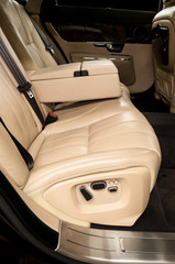 Back passenger seats in business car. Interior detail.