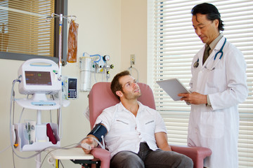 Doctor and patient conversing about care