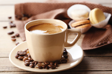 Gentle colorful macaroons and  coffee in mug