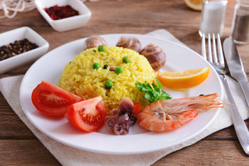 Seafood Paella on plate on table close-up
