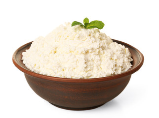 Cottage cheese with mint in clay bowl isolated on white