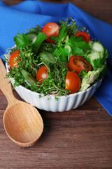 Cress salad with sliced cucumber, cherry tomatoes and parsley