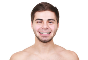 Obraz premium Portrait of young smiling man isolated on white