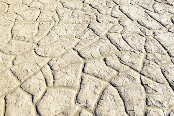 cracked and dry lakebed in the desert