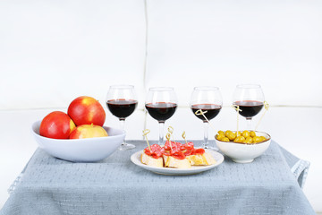 Table at home with food and drinks for friends