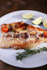 Dish of Pangasius fillet with spices and vegetables