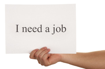 Sheet of paper with inscription I need a job in male hand