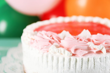 Delicious cake on table  bright background